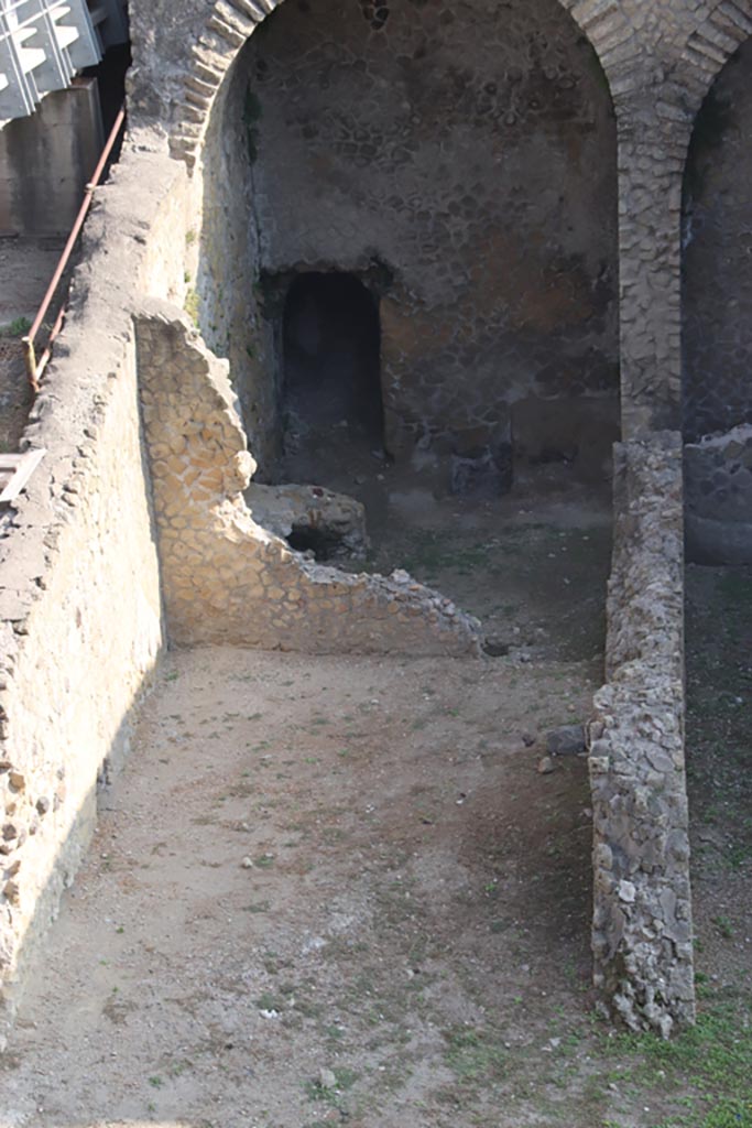 III.1/2/18/19, Herculaneum, October 2023. 
Looking north from access roadway towards area of rooms G, H, I, L, M, on west side of lower floor.
Photo courtesy of Klaus Heese.